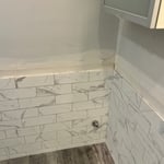 Drywall repair and tile work.