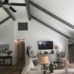 Living room can lights and ceiling fan.