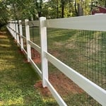 3 rail paddock in vinyl with mesh.