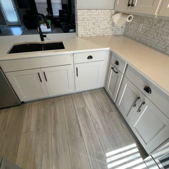 Cabinets finished. New backsplash, countertops, plumbing, and hardware.