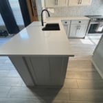 Cabinets finished. New backsplash and countertops installed. Lowered split level counter to counter height and extended counter to add more seating.