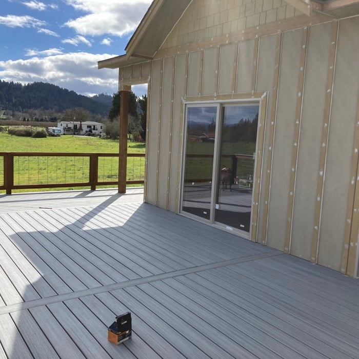 Gorgeous hidden screw decking and unique railing design.