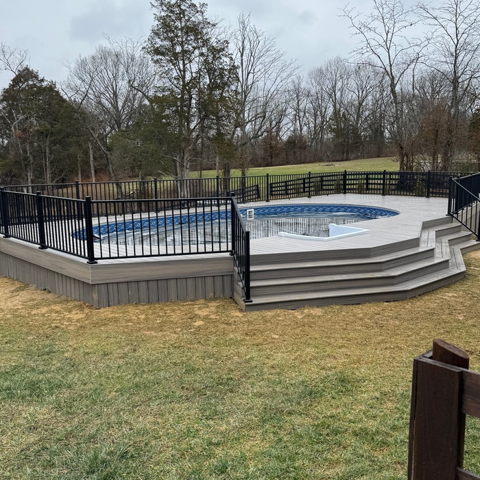 Custom pool deck in trex enhance rocky harbor, with westbury aluminum railing
