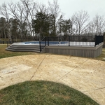 Custom skirting in trex rocky harbor to create storage underneath sun deck and give a more homogenous look