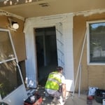 Our door install team preparing the opening for the entry door.