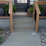 New concrete porch and custom railing