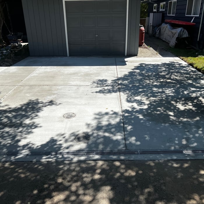Green wood concrete driveway