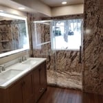 View of the new Walk-In shower, his and her sink and mirror with lighting.