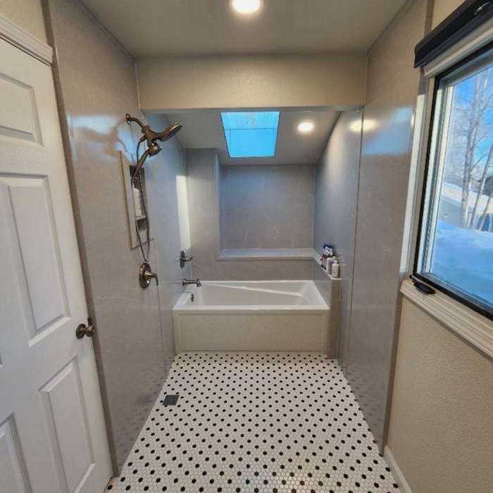 Open shower concept with bathtub.