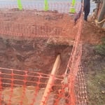 Sewer installation under road.