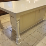 Custom built island with 34" deep, rollout shelving, 34" drawer and double-bin trash cans!