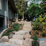 Mendota Heights Backyard Living Area Renovation. Steps leading from patio to front of home.