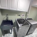 Basement Remodel: Laundry Room Edition
- Turkish tile in a fun matte pattern
- Modern Utility Sink with Matte Black Fixture
- Upper Cabinets closed storage