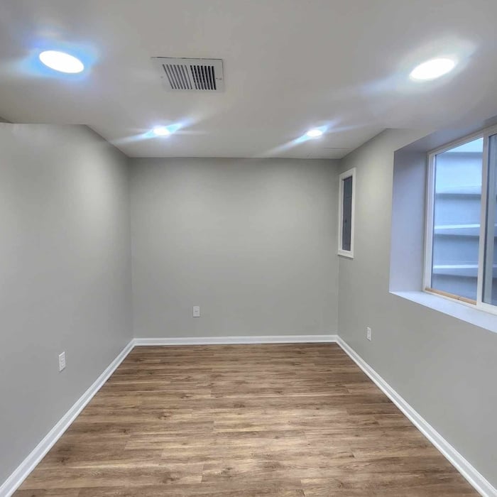 Basement Remodel: Home office/Workout Room with lots of natural light, safe escape Egress, and waterproof luxury vinyl plank!