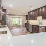 Kitchen remodel in Vienna, VA with wooden cabinets, granite countertop & tiles