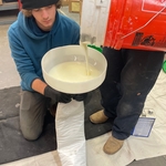 Mixing resin for liners, this resin gardens to create a solid pipe