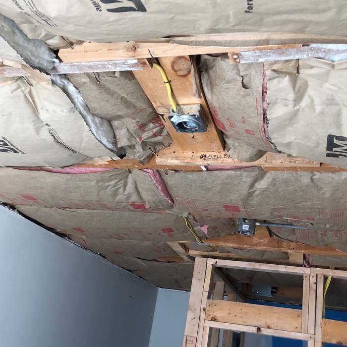 Adding new insulation in ceiling.