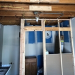 Creating space for the small bathroom. Wood framing