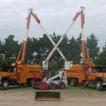 Two of our trucks and our bobcat