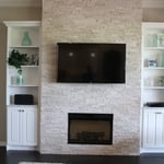 Fireplace built in shelves with TV