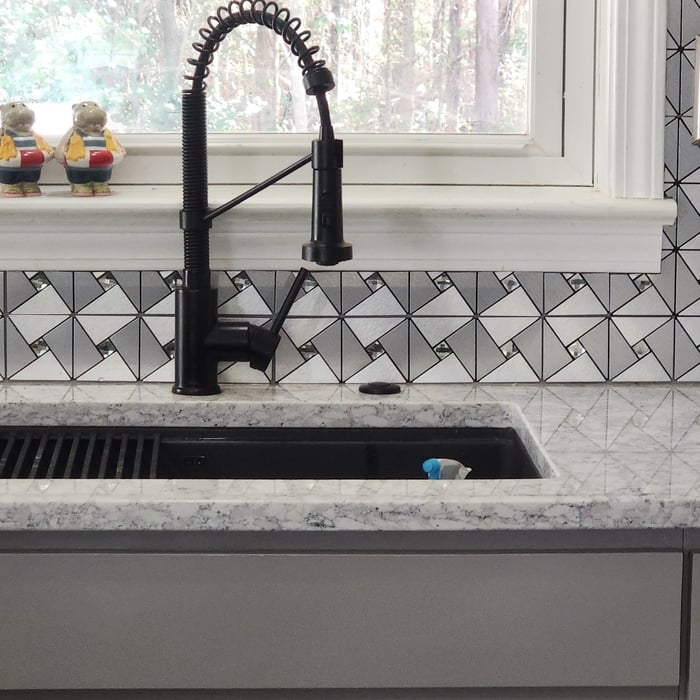 Matching quartz counter tops to match the neutral grey theme, and introduce the cleanliness of white with the associated trim nearby