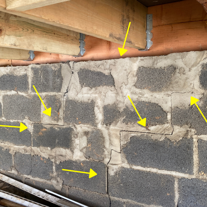 Cracks in the Foundation- Here we find moderate cracks in the foundation, with evidence that they've been repaired before.
