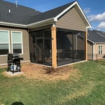 Finished project. Roof ties into existing house to appear as though it was built with the house. Screen room added. Natural wood columns without stain or paint.