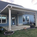 Insulated roof panel addition with 6x6 columns and a 3x8 header beam.
