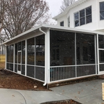 Patio cover with screen room. Includes gutters and downspouts.