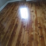 Refinished antique White Pine floor after paint sanded off and polyurethane applied