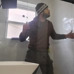 Me install the double sliding door glass in the new shower.
