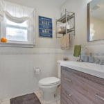 Mold removal and repair to bathroom. Including new tiles, vanity and painting.