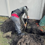 Digging carefully next to utility cable. Our professional team can do it without any damages