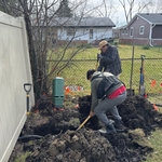 Digging carefully next to utility cable. Our professional team can do it without any damages