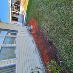 (After) washout backfilled/compacted, perimeter slab poured, siding put back in place. (2 of 2)