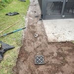 yard drain system backfilled/graded ready for sod. Eliminating flooding in lanai. (2 of 2)