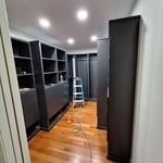 This master closet is beautiful! I'm glad I was given the opportunity to add the lighting in here!