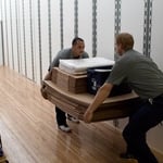 Carrying boxes, bubble wrap, and other supplies for a move