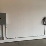 Conduit & Copper Wire being Installed to Panel in the Garage