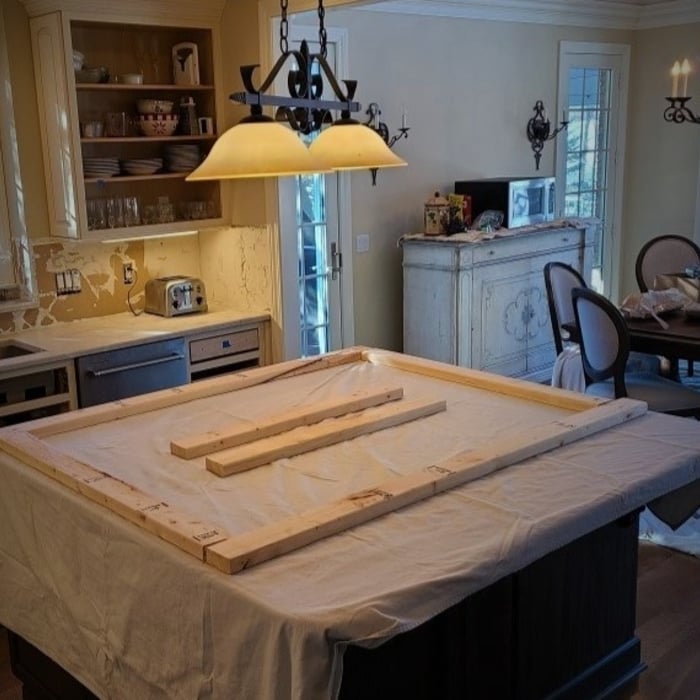 Laying out of 2x4 base over the edges of the cabinets beneath for weight distribution.