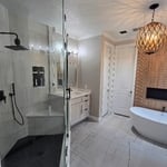 shower, vanity, floor and tub