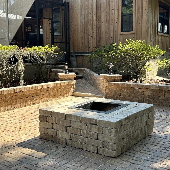 Paver patio with walls, lights and a firepit