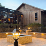 Paver patio with walls, lights and a firepit