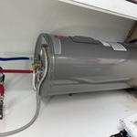 Removed and replaced an old tank water heater with a new unit. Installation included all connections, testing, and leak checks to ensure safe and reliable operation.