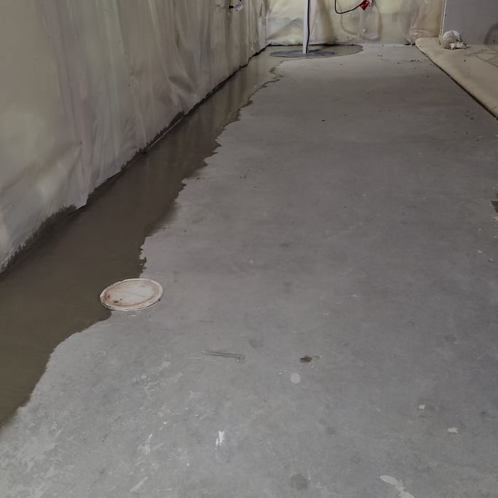 After installing the sump pump and the drain tile system, our team repours the concrete.