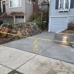 Widen driveway by moving rockery back 2' and placed in new driveway, retaining walls, steps, porch and walkways