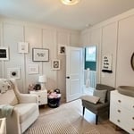 Nursery with upgraded wall paneling and paint