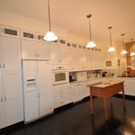 A great combination of White Cabinetry with Dark hardwood flooring.