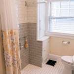 The entire bathroom was waterproofed and slopped perfectly to prevent leaking, but maintain her stability in either wheelchair or with arm braces.