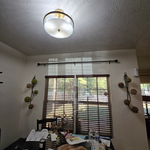 Install curtain rods and hang mirro